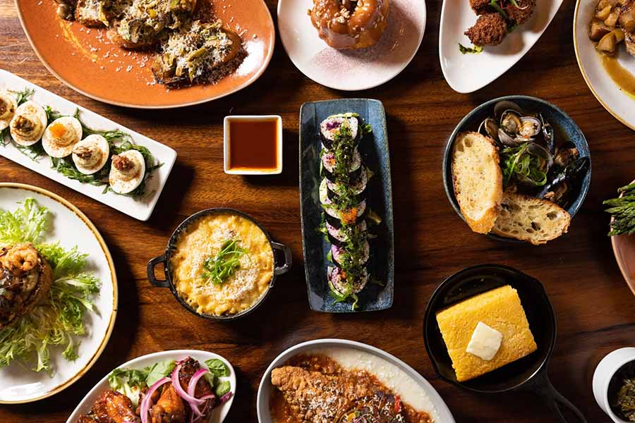 Seattle FIFA World Cup 2026. A spread of beautifully plated dishes at COMMUNION restaurant in Capitol Hill, Seattle.